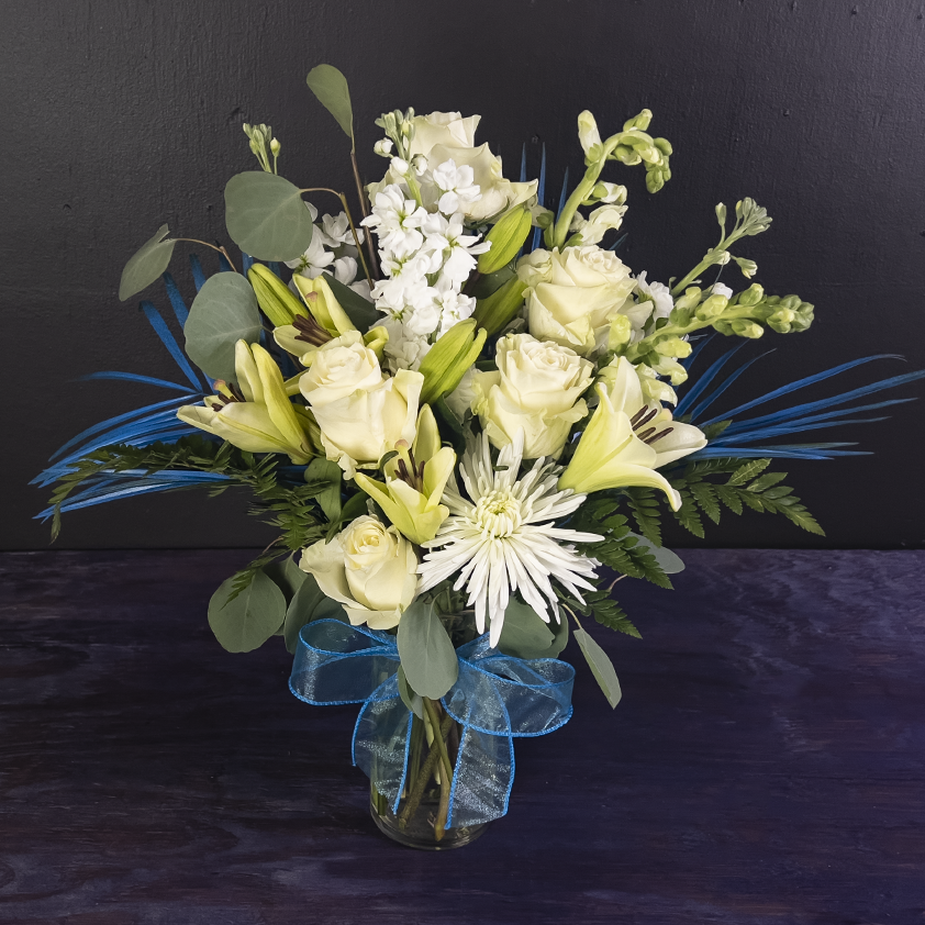 elegant white rose and blue ribbon arrangement from bloombudz in Paragould, AR