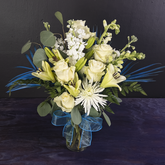 elegant white rose and blue ribbon arrangement from bloombudz in Paragould, AR