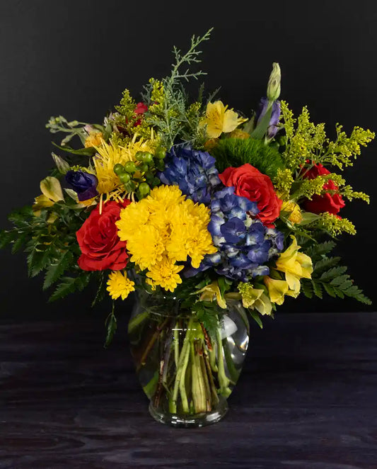 Colorful flower arrangement with mixed florals by bloombudz in Paragould, AR
