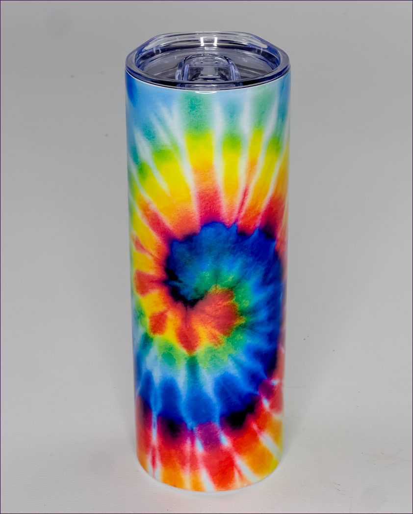 Tie-dye tumbler with a colorful spiral pattern on a gray background