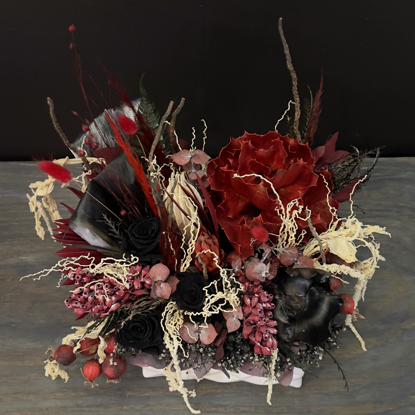 black forever roses and red accent preserved floral arrangement from bloombudz in Paragould, AR
