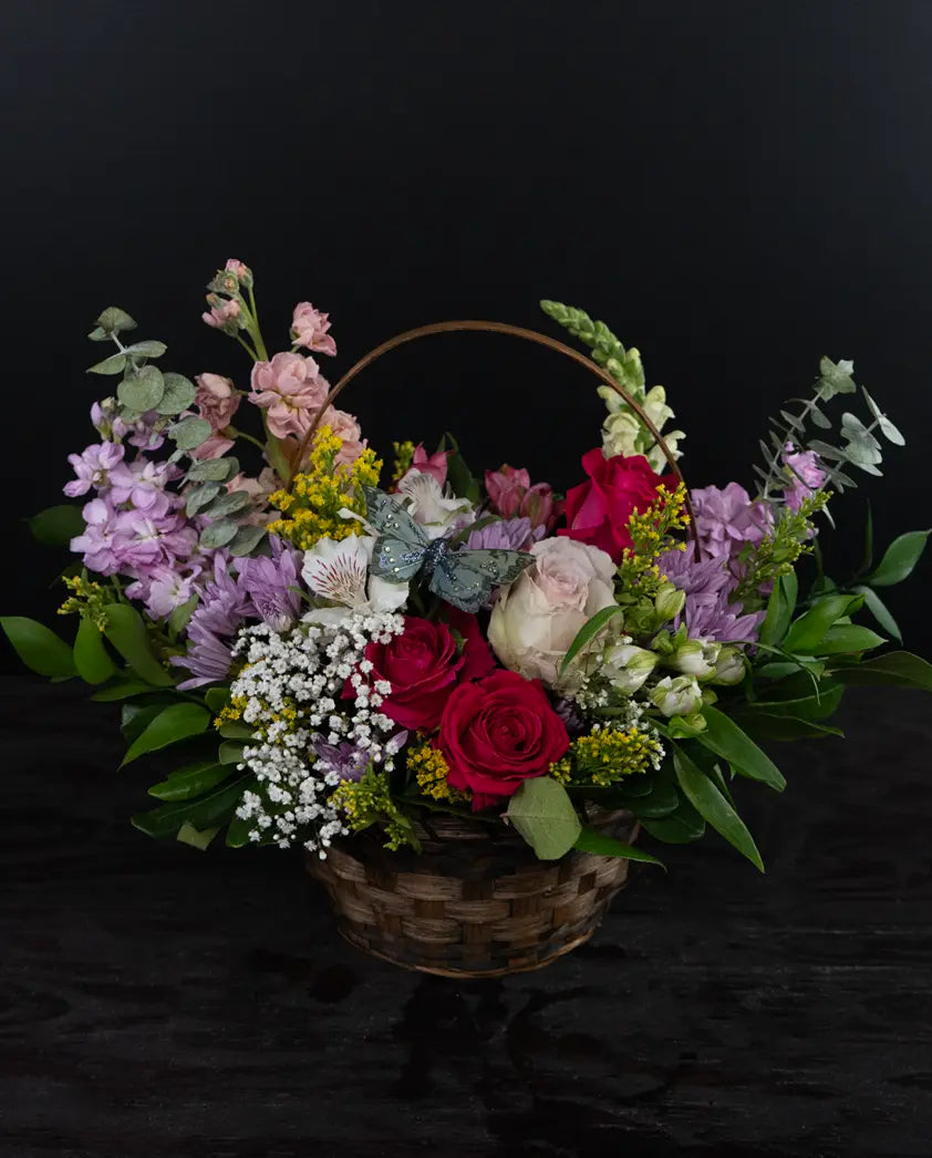 Basket of flowers with a dark background