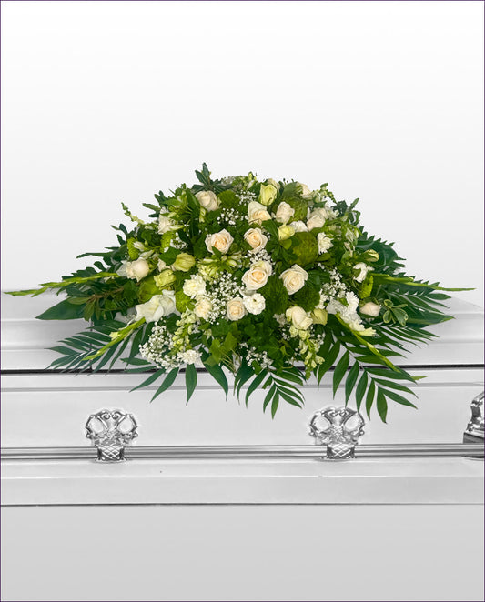 caskey spray Floral arrangement on a white casket
